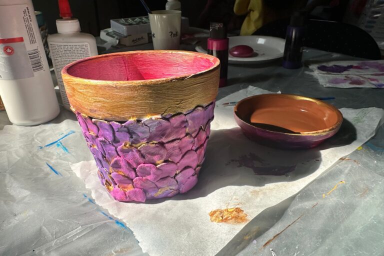 Add finishing touches to mermaid flower pots