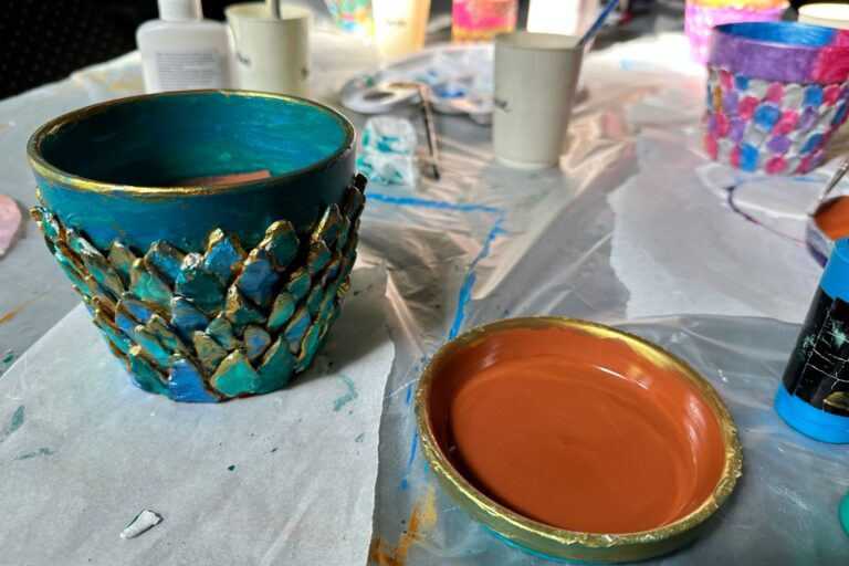 Add finishing touches to mermaid flower pots
