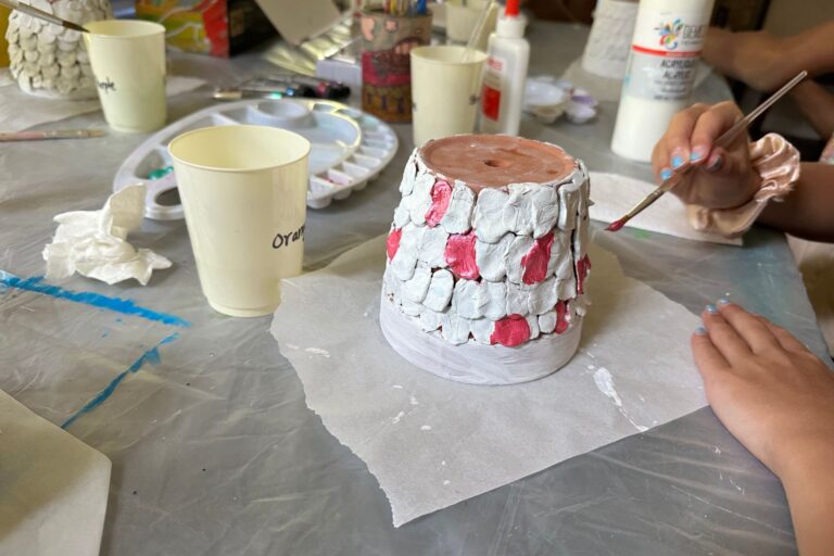 mermaid flower pot being painted